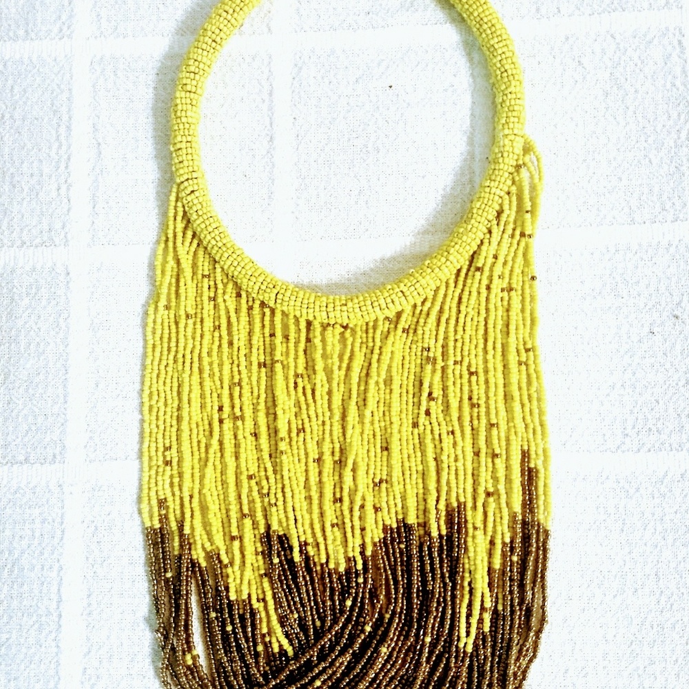 Stunning yellow and tan African beaded necklace.